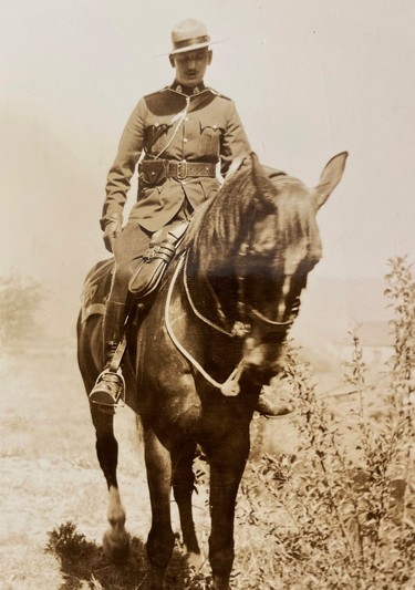 Joe Atherton riding a horse in an old photograph.