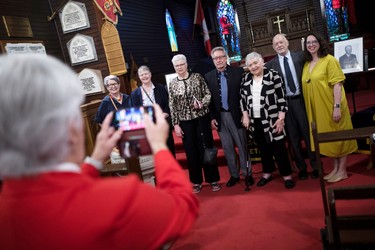 From left, Joe Atherton’s nieces, Nancy Miller and Pat Sanagan; his niece by marriage Janan Carr and her husband, Terry; his niece by marriage Jacquie Stinson; and his nephew, writer Tony Atherton, and Tony’s daughter, Emily. The group are having their photo taken in a church.