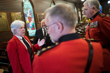 RCMP Cpl. Donna Morse speaks with members of the RCMP Veterans' Association during a memorial ceremony at the Depot chapel in Regina.