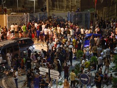 A crowd of migrants standing in the streets at Bab Sebta, on the Morocco-Spain border.