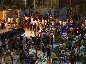 A crowd of migrants standing in the streets at Bab Sebta, on the Morocco-Spain border.