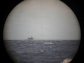A ship sinking into the ocean.
