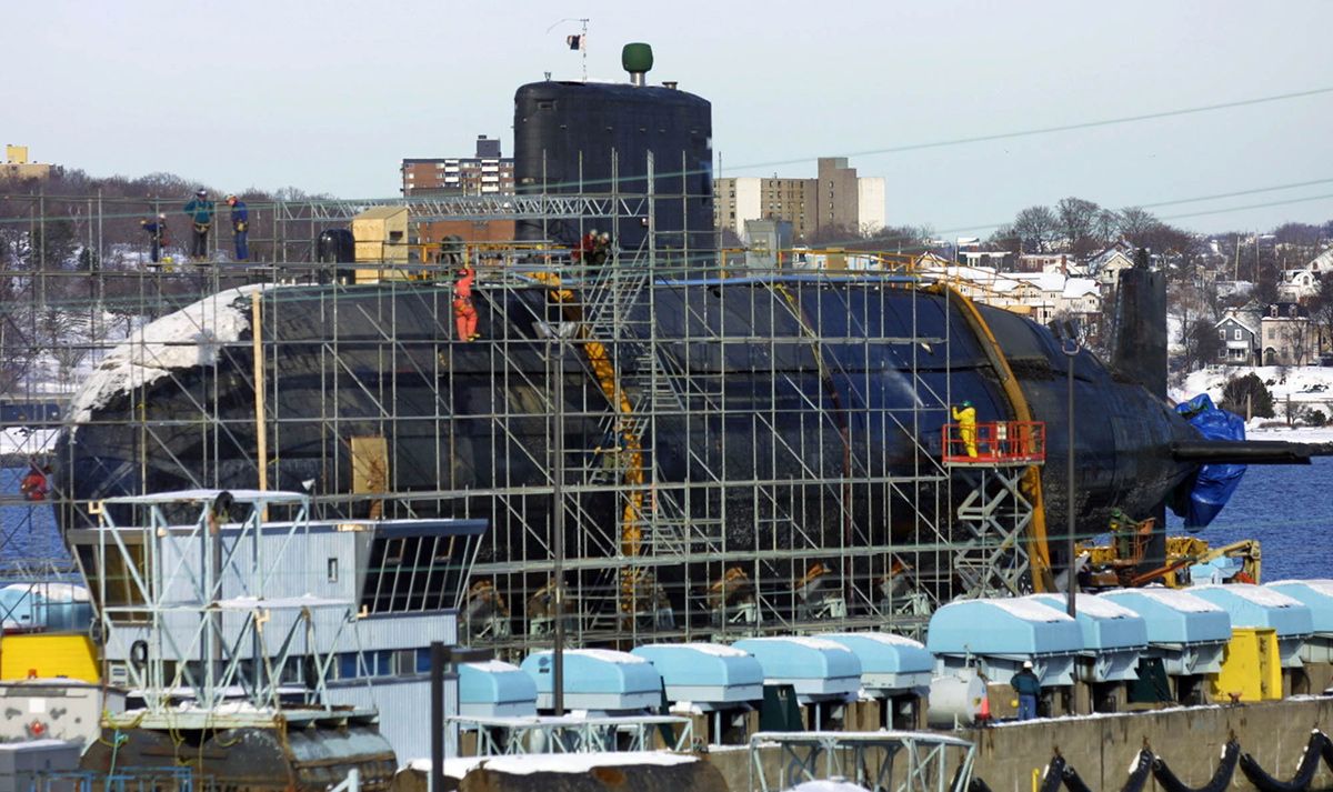  HMCS Victoria stands drydocked and wrapped in scaffolding at CFB Dockyards in Halifax in 2021.
