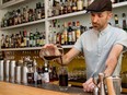 A bartender mixes cocktails.