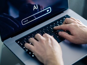 Person using AI on computer.