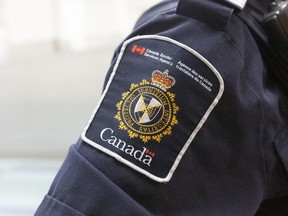 A shoulder of a CBSA officer, showing his CBSA patch.