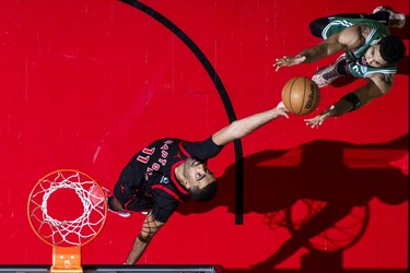 Toronto Raptors #11 Jontay Porter pictured from above as he rebounds the ball during a game.