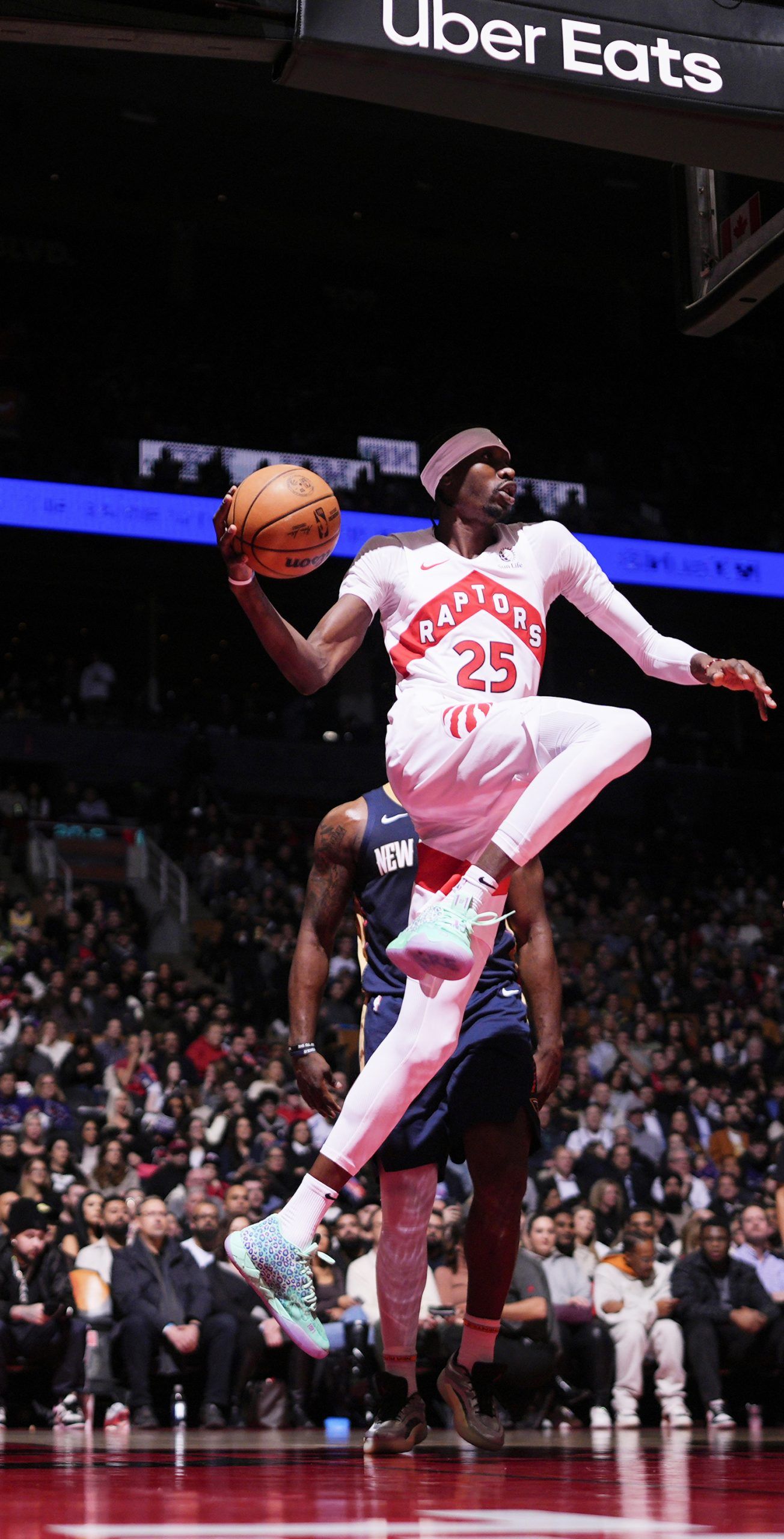 Chris Boucher of the Toronto Raptors passes the ball during the game against the New Orleans Pelicans on Jan. 27, 2025, in Toronto, Ont.