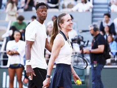 Gael Monfils of France and his wife, Elina Svitolina of Ukraine, walking next to eachother while wearing tennis kit.