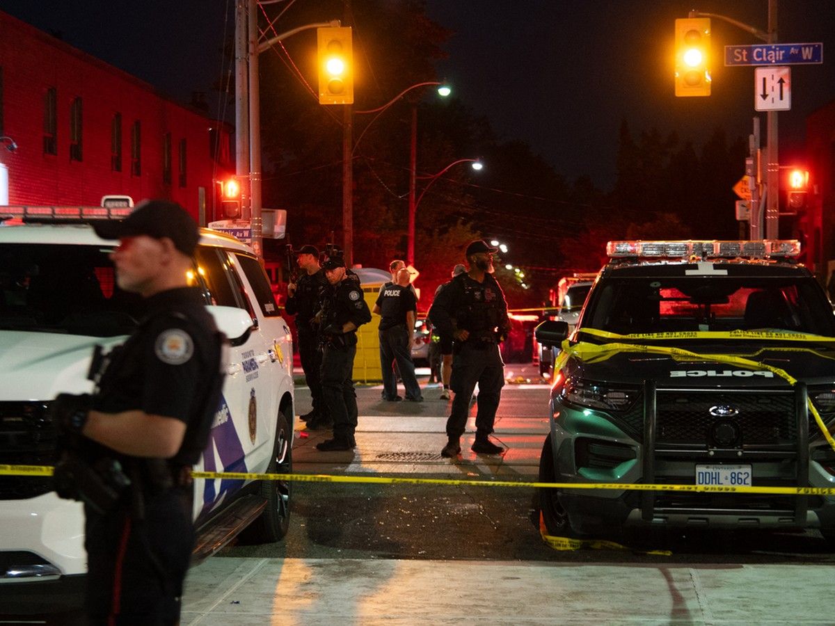 Police officers and other law enforcement personnel are seen at the intersection of St. Clair West and Arlington Avenue, near the site of a shooting that occurred at the Salsa on St. Clair Festival in Toronto on the evening of July 11, 2026. Police officers and other law enforcement personnel are seen at the intersection of St. Clair West and Arlington Avenue, near the site of a shooting that occurred at the Salsa on St. Clair Festival in Toronto on the evening of July 11, 2026.