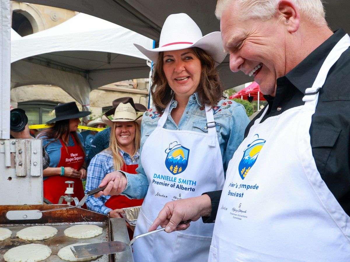 Alberta Premier Danielle Smith and Ontario Premier Doug Ford cook pancakes at the annual Premier’s Stampede Breakfast at McDougall Centre in Calgary on Monday, July 7, 2025. Alberta Premier Danielle Smith and Ontario Premier Doug Ford cook pancakes at the annual Premier’s Stampede Breakfast at McDougall Centre in Calgary on Monday, July 7, 2025.
