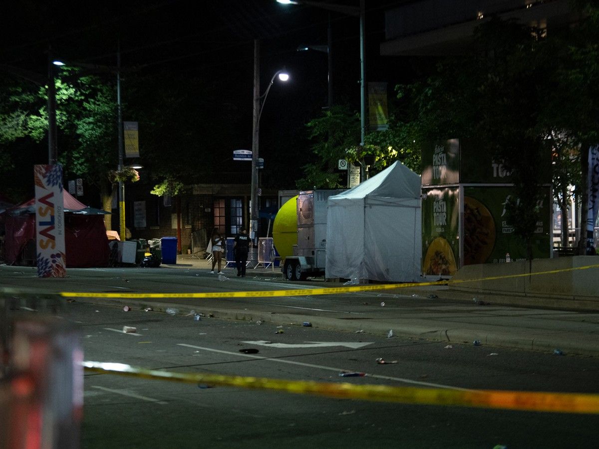Police officers are seen at the intersection of St. Clair West and Arlington Avenue, near the site of a shooting that occurred at the Salsa on St. Clair Festival in Toronto on the evening of July 11, 2026. Police officers are seen at the intersection of St. Clair West and Arlington Avenue, near the site of a shooting that occurred at the Salsa on St. Clair Festival in Toronto on the evening of July 11, 2026.