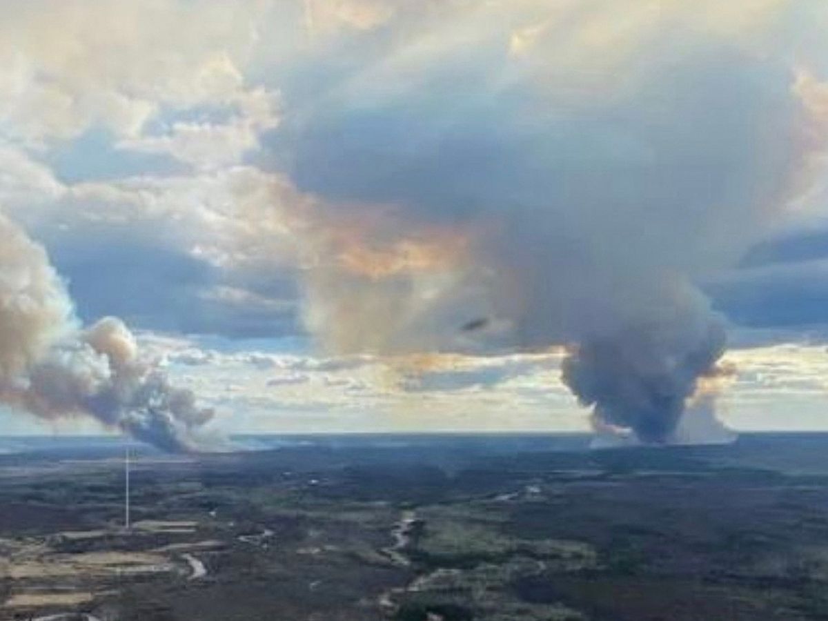 Smoke columns rise from wildfires near Fort McMurray, Alberta, in May 2024. Smoke columns rise from wildfires near Fort McMurray, Alberta, in May 2024.