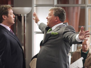James Spader and William Shatner wearing suits and talking to eachother in a scene from TV's Boston Legal.