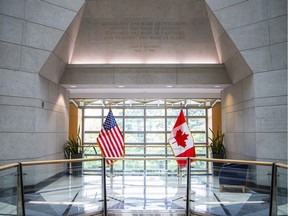 A U.S. and Canadian flag in the lobby of the U.S. Embassy in Ottawa.