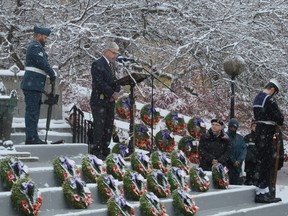 Padre Rory MacDonald (at the podium) speaks to the crowd and leads a prayer on Remembrance Day on Tuesday, Nov. 11, 2025, in Cornwall, Ont.
