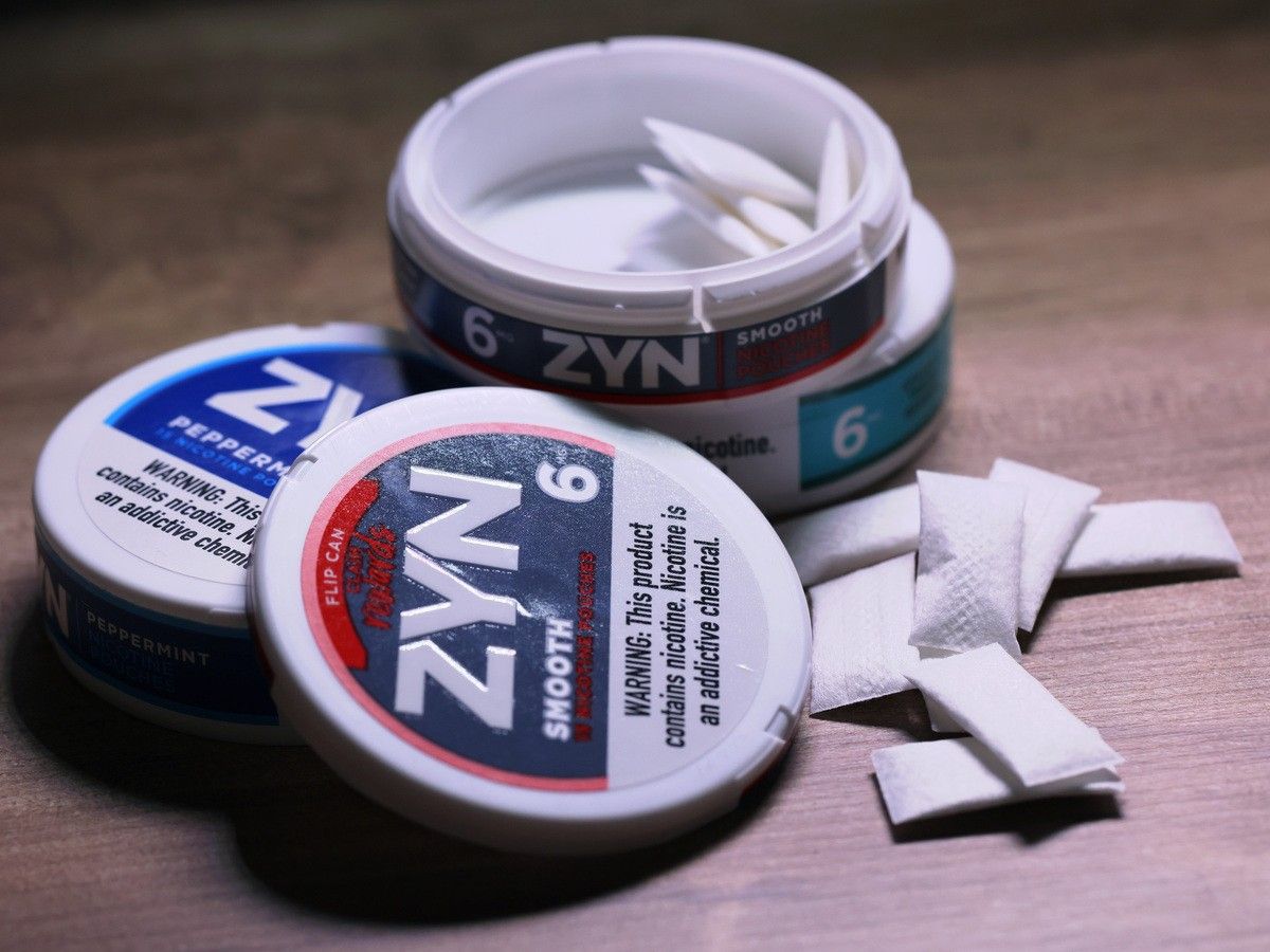 In this photo illustration, ZYN nicotine cases and pouches are seen on a table on January 29, 2024. In this photo illustration, ZYN nicotine cases and pouches are seen on a table on January 29, 2024.