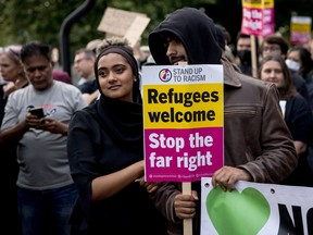 Activists take part in a rally ahead of a rumoured anti-immigrant protest on August 7, 2024 in Brentford, United Kingdom.
