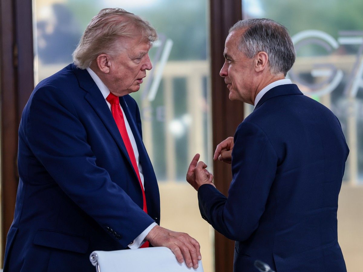 U.S. President Donald Trump speaks with Canadian Prime Minister Mark Carney at a working lunch with leaders of G7 and the Middle East, on June 16, 2026 in Evian-les-Bains, France. 