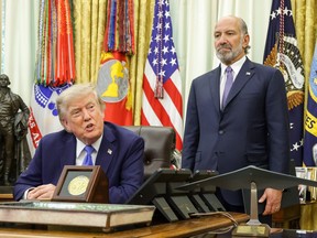 Donald Trump, left, Howard Lutnick, right, in the OVal office