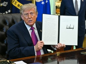 Donald Trump in the Oval Office with a signed order to change Lake Ontario to Lake America.