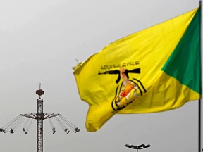 A flag featuring an arm holding a rifle.