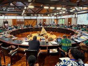 People sit around a round table.