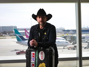 Music star Paul Brandt in his cowboy hat at Calgary airport.