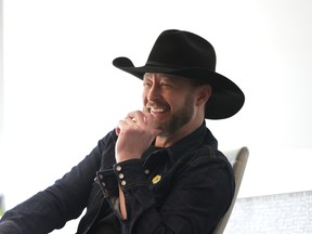 Paul Brandt smiling in a cowboy hat