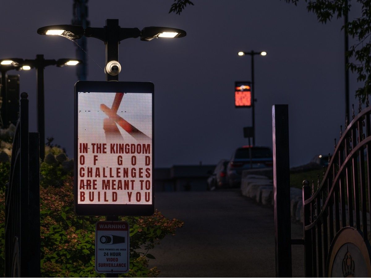  LED panels display various messages and announcements along the main entrance to the Miracle Arena Church property in Vaughan in August, 2026.