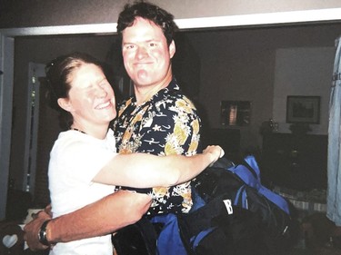 Stephen Heimbecker and his sister Julie Meier, embrace.