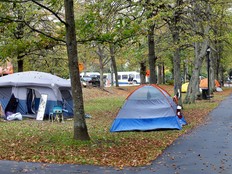Tents pitched in a public park.