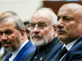 Iran's Parliament Speaker Mohammad Bagher Ghalibaf, middle, threatened to up the intensity of Iranian strikes.