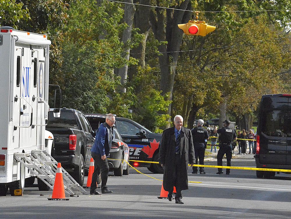 Officials with the Special Investigations Unit are seen exiting an SIU vehicle on Victoria Avenue on the morning of Monday, Sept 21, not far from the Sons of Jacob Synagogue in Belleville.