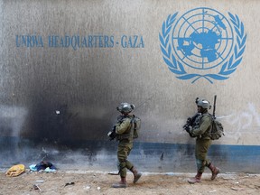 This picture taken during a media tour organized by the Israeli army on February 8, 2024, shows Israeli soldiers inside an evacuated compound in Gaza.