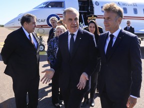 French President Emmanuel Macron, right, and Canadian Prime Minister Mark Carney