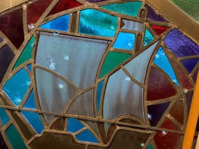 Bullet holes in stained glass
