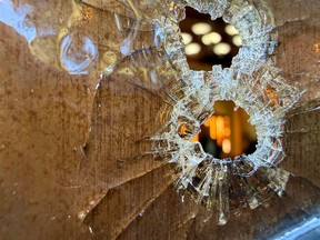 Bullet holes are seen in the stained-glass windows at the Sons of Jacob Synagogue in Belleville, Ont.