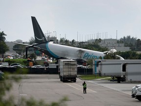 An Amazon cargo plane is seen after it crashed