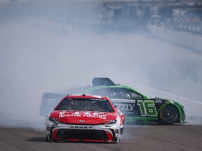 Fre Nicotine Pouches-sponsored driver Riley Herbst (No. 35) and Grizzly Nicotine Pouches-sponsored driver AJ Allmendinger (No. 16) spin after an on-track incident during the NASCAR Cup Series on Sept. 13, in Madison, Ill.