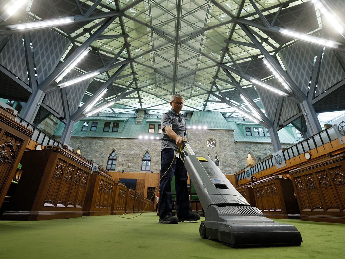 Man vacuuming in House of Commons .