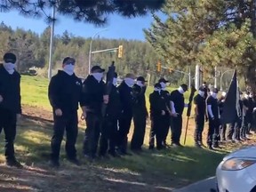 Masked people in a line.