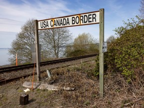 Approximately one hundred people gathered at Peace Arch Park at the US-Canada border to support Canada-US relations Saturday, April 5, 2025.