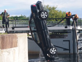 Car hoisted out of water.