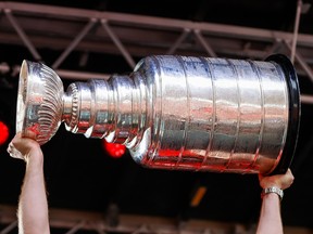 The Stanley Cup being hoisted.