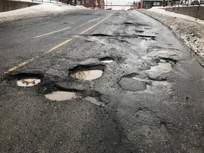 Potholes in a road.