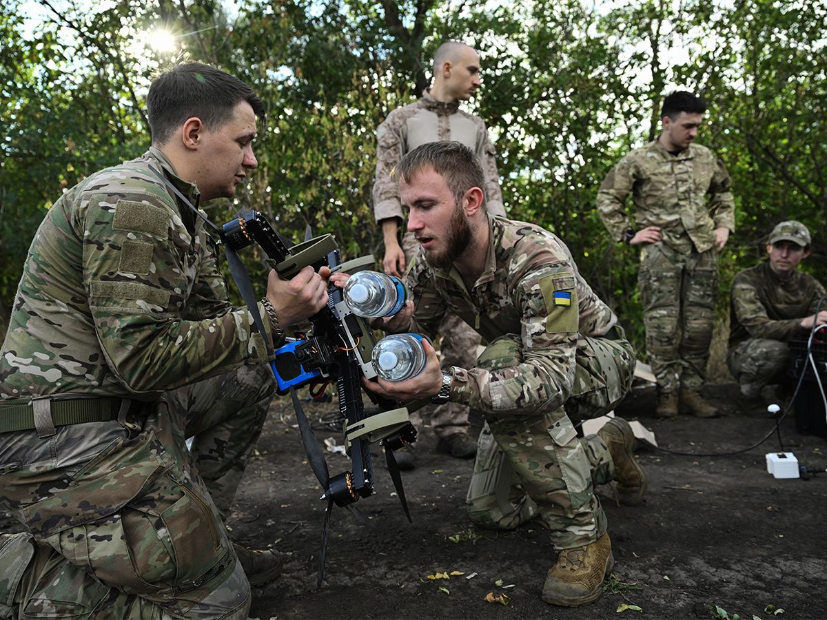 Ukrainian servicemen prepare a FPV drone for a training flight.