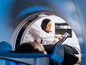 A patient lies inside and MRI machine.