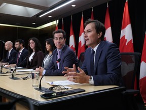 Jay Solomon, CEO of Hillel Ontario, Noah Shack, CEO of Centre for Israel and Jewish Affairs, Livia Mamane, student at University of Quebec in Montreal, Kate Blumberg, student at McMaster University, Anthony Housefather, Member of Parliament, and Adam Chambers, Member of Parliament, take part in a press conference on Parliament Hill.