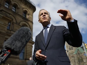 Prime Minister Mark Carney speaks to journalists outside his office in Ottawa on September 1, 2026.